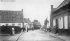 Vue de la rue de la Chapelle vers la rue de la Place en 1908. En arrire plan, la forge Eloire.